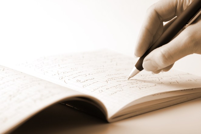 hand writing in notebook